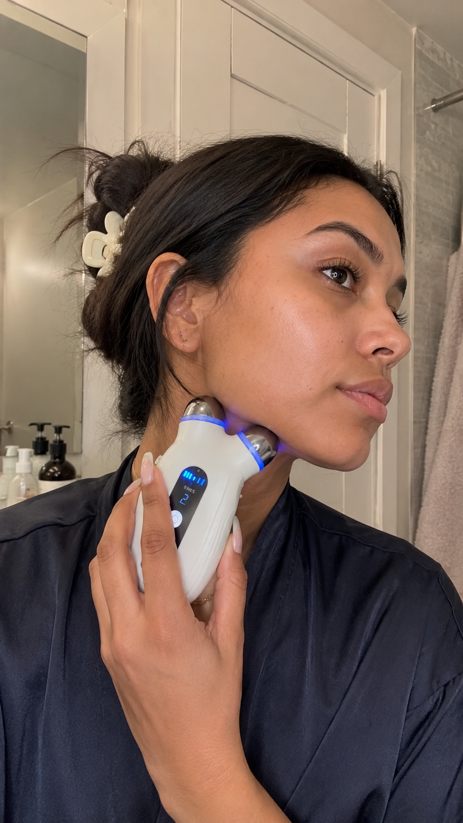 Customer using the Lumecūr microcurrent device at home