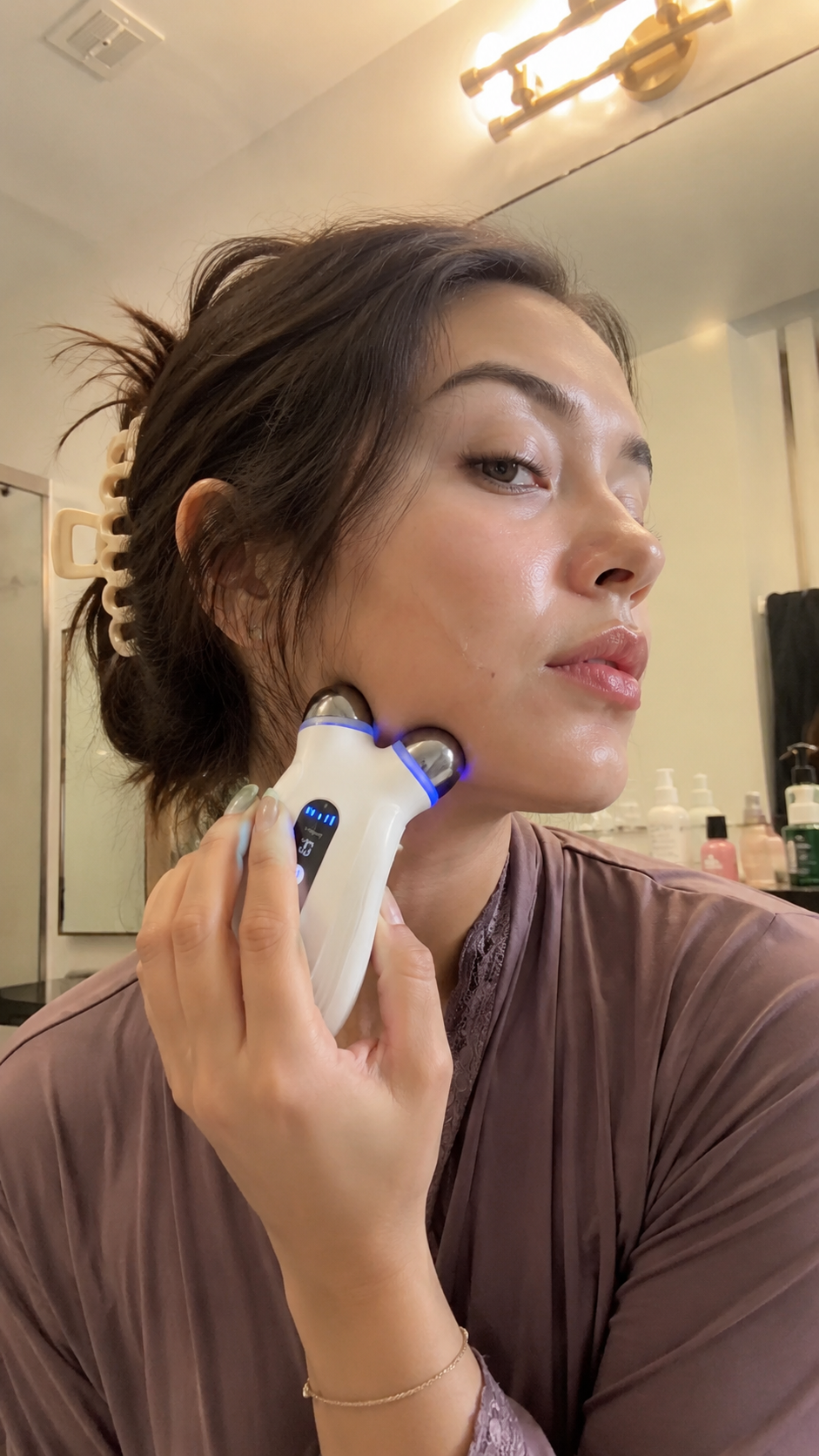 Customer using the Lumecūr microcurrent device at home